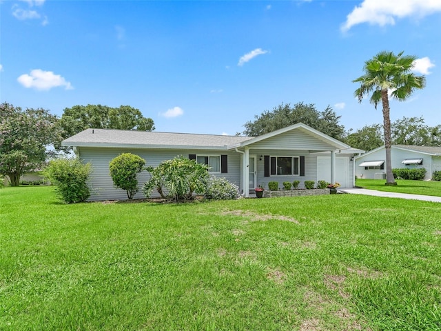 single story home with a front yard and a garage