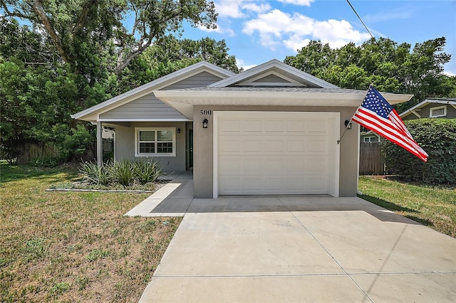 ranch-style home with a garage and a front yard