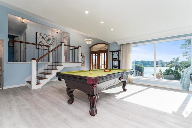 recreation room with a water view, light hardwood / wood-style flooring, and pool table