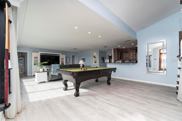 game room with vaulted ceiling, pool table, and light hardwood / wood-style flooring