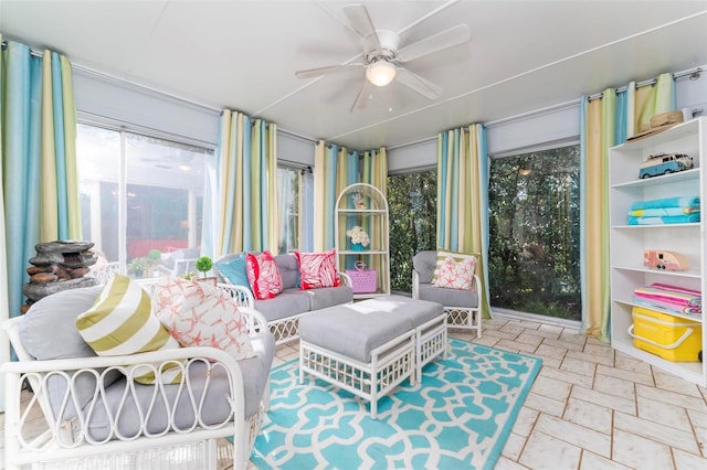 sunroom featuring plenty of natural light and ceiling fan