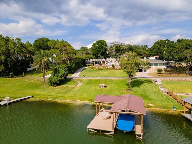 dock area with a water view and a lawn