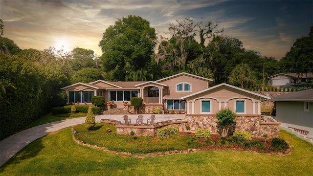 view of front of home with a lawn