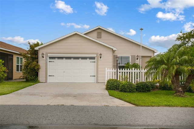 ranch-style home with a garage and a front yard