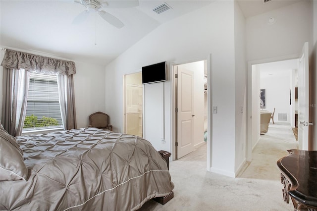 carpeted bedroom featuring ceiling fan, connected bathroom, and lofted ceiling