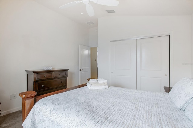 bedroom with ceiling fan, lofted ceiling, carpet floors, and a closet