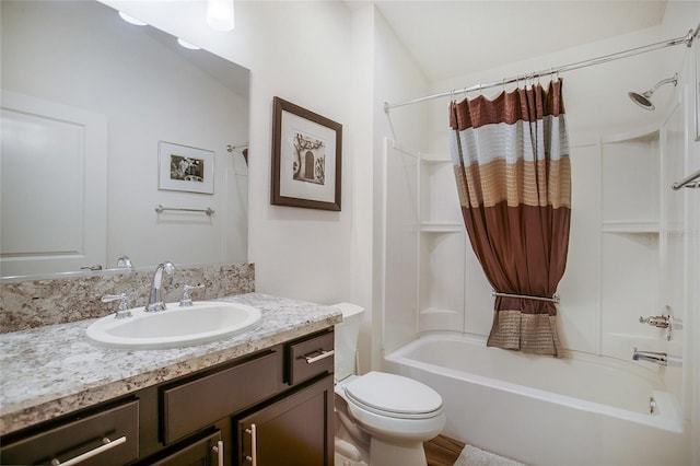 full bathroom with toilet, shower / tub combo, and vanity