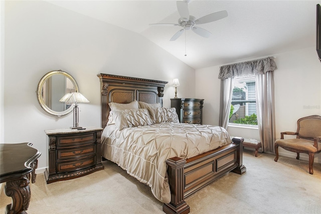 carpeted bedroom featuring ceiling fan and vaulted ceiling