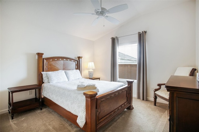 carpeted bedroom with ceiling fan and lofted ceiling