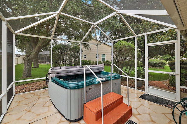 exterior space featuring a lanai and a hot tub