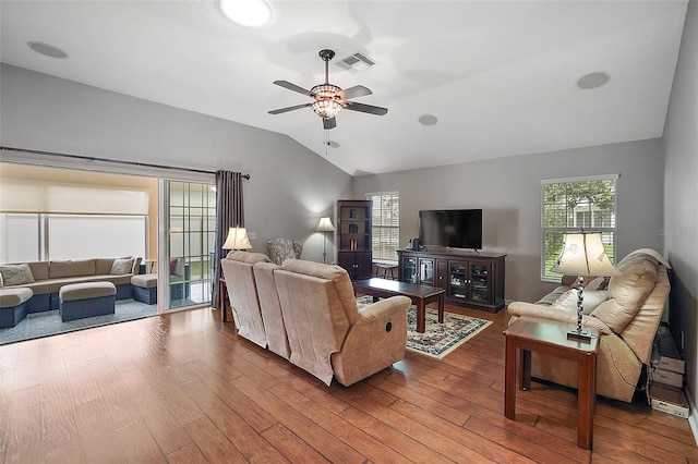 living room featuring hardwood / wood-style flooring, ceiling fan, and lofted ceiling