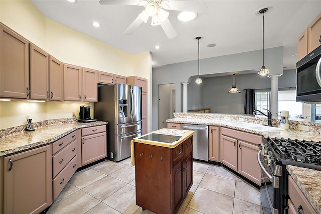 kitchen featuring pendant lighting, sink, ceiling fan, light tile patterned floors, and appliances with stainless steel finishes