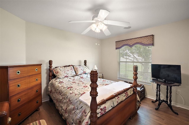 bedroom with ceiling fan and dark hardwood / wood-style flooring