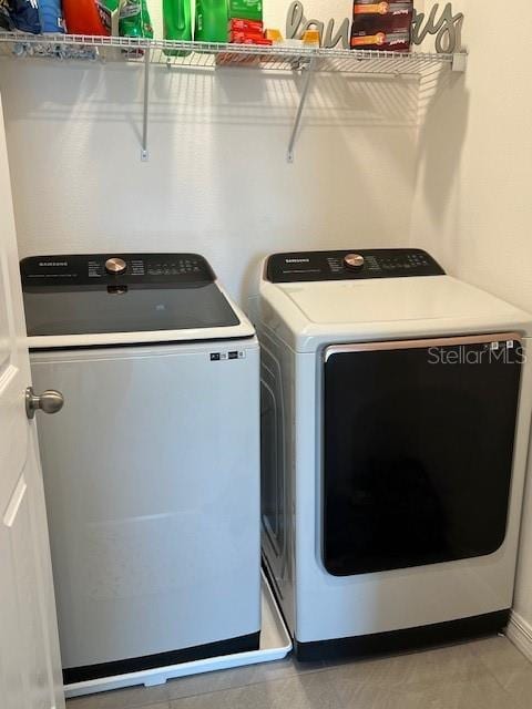 washroom featuring washer and dryer