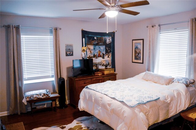 bedroom featuring dark wood-type flooring and ceiling fan