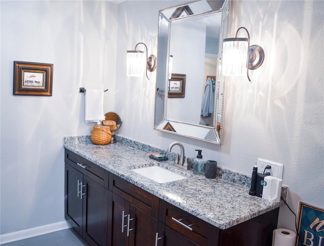 bathroom with tile patterned floors and vanity