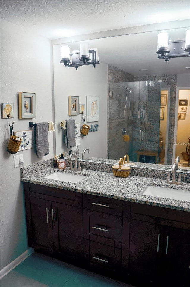 bathroom with walk in shower and vanity