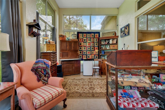 sitting room with light tile patterned floors