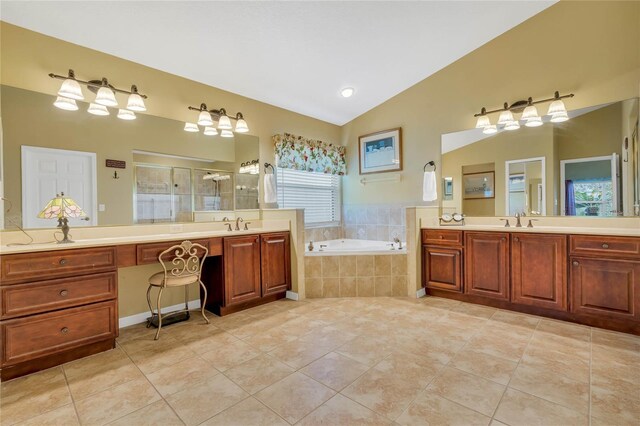 bathroom featuring vanity, shower with separate bathtub, lofted ceiling, and tile patterned floors