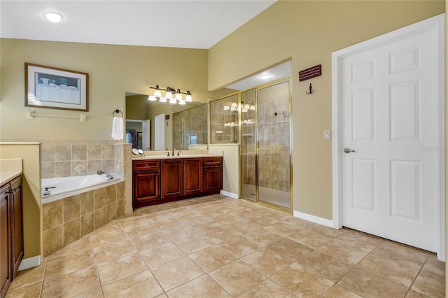 bathroom with tile patterned floors, lofted ceiling, shower with separate bathtub, and vanity