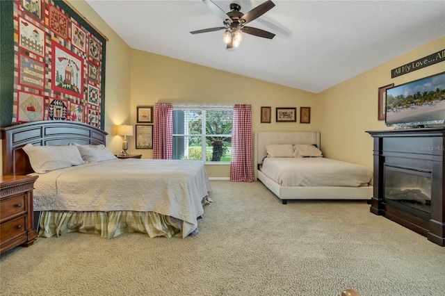 carpeted bedroom featuring vaulted ceiling and ceiling fan