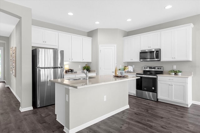 kitchen with sink, white cabinets, and stainless steel appliances