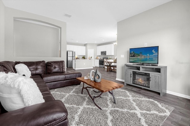 living room with dark wood-type flooring