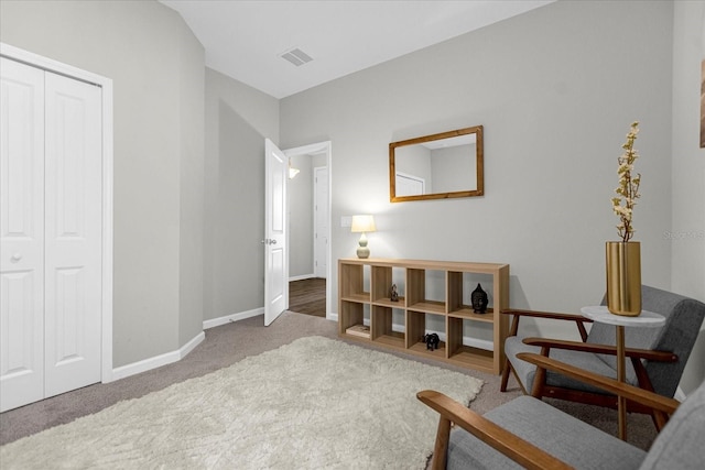 living area featuring carpet floors