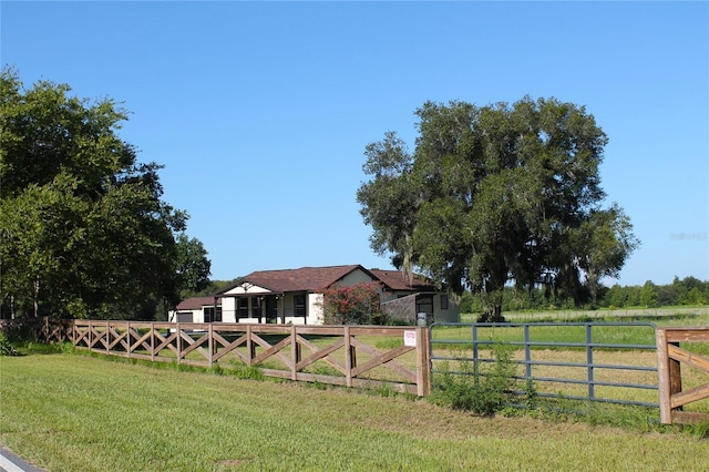 view of yard featuring a rural view and fence