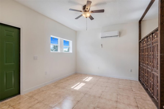 spare room with a wall mounted AC and ceiling fan