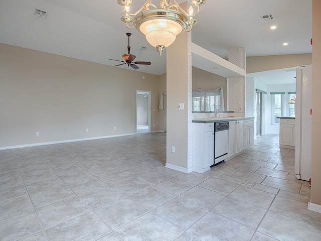 kitchen featuring light tile patterned floors, white cabinetry, lofted ceiling, white dishwasher, and ceiling fan with notable chandelier