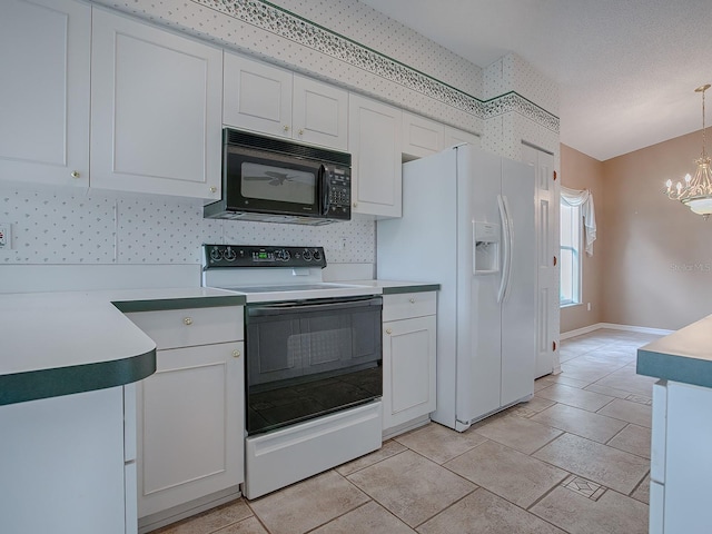 kitchen featuring an inviting chandelier, range with electric cooktop, hanging light fixtures, white refrigerator with ice dispenser, and white cabinets