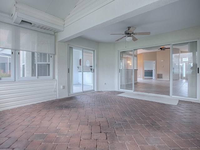 view of patio featuring ceiling fan