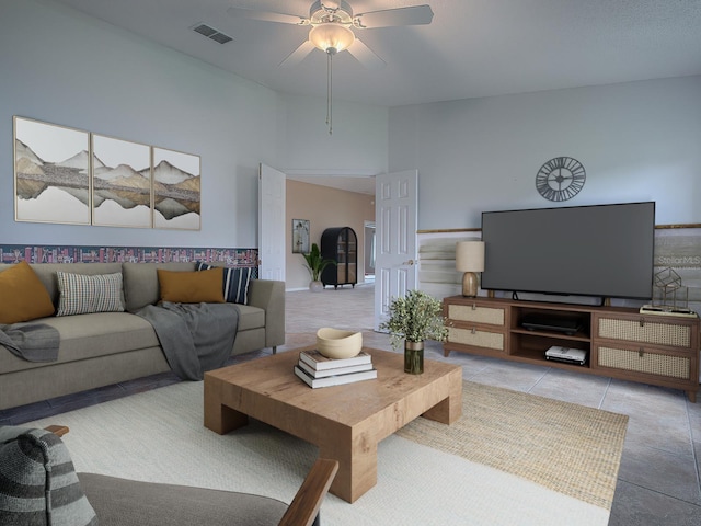 tiled living room featuring ceiling fan