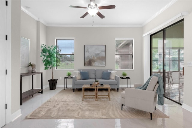 living room with ceiling fan and ornamental molding