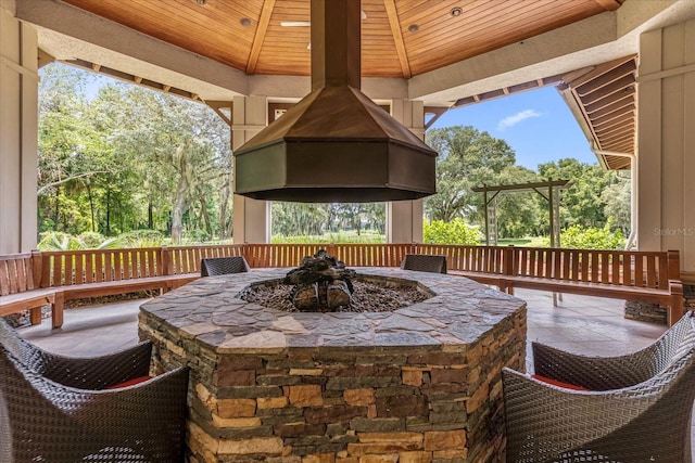 view of patio / terrace featuring a fire pit and a gazebo