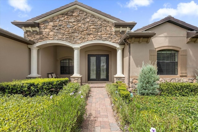 property entrance featuring french doors