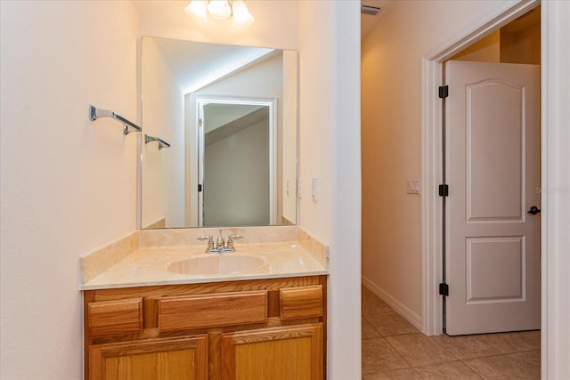 bathroom with tile patterned floors and vanity