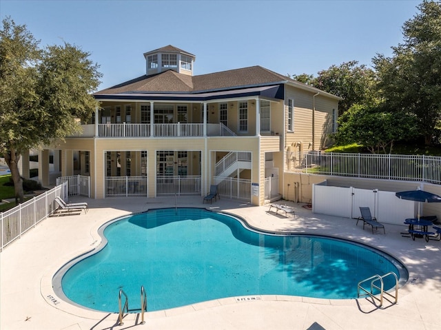 view of swimming pool with a patio area