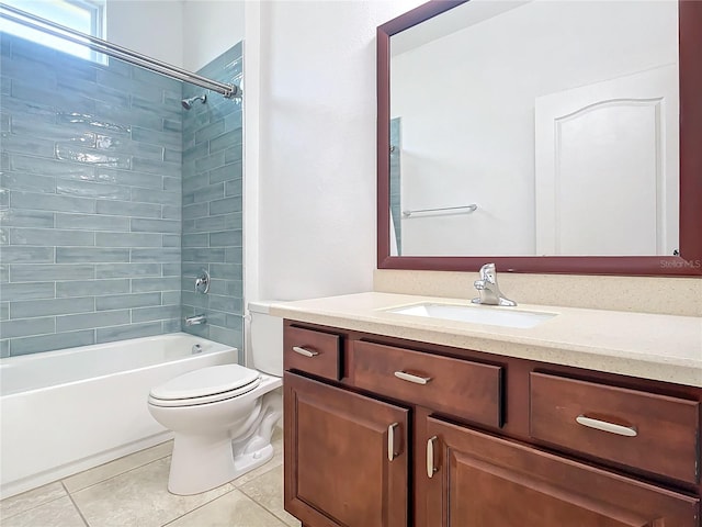 bathroom featuring toilet, tile patterned flooring, vanity, and bathing tub / shower combination