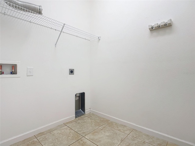 laundry area with laundry area, washer hookup, light tile patterned flooring, and hookup for an electric dryer