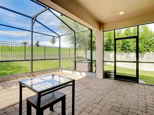 unfurnished sunroom featuring a wealth of natural light