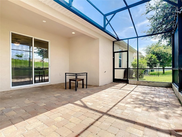 unfurnished sunroom with beamed ceiling