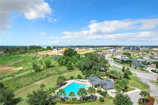 birds eye view of property with a residential view