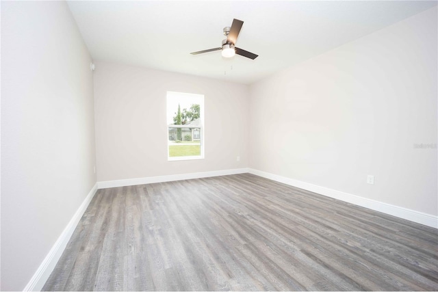 spare room with ceiling fan and hardwood / wood-style floors