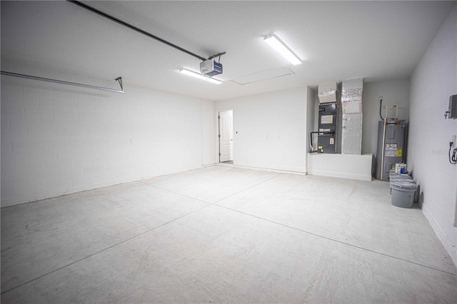 garage featuring electric water heater, a garage door opener, and heating unit