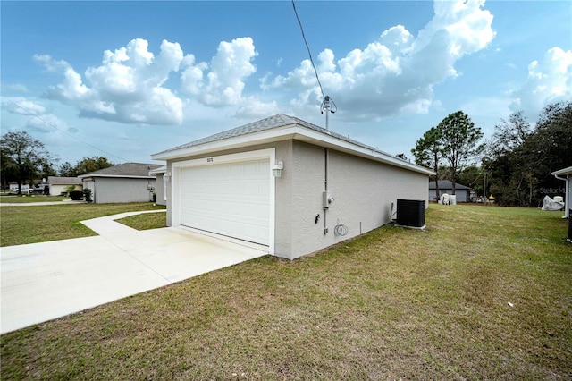 view of home's exterior with a garage, a yard, and central air condition unit