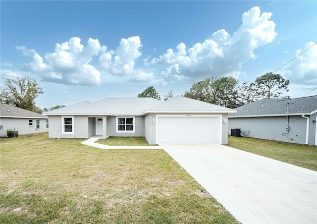 single story home featuring a garage, central AC, and a front lawn