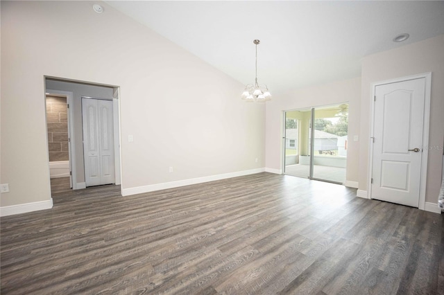 unfurnished room with high vaulted ceiling, an inviting chandelier, and dark hardwood / wood-style flooring