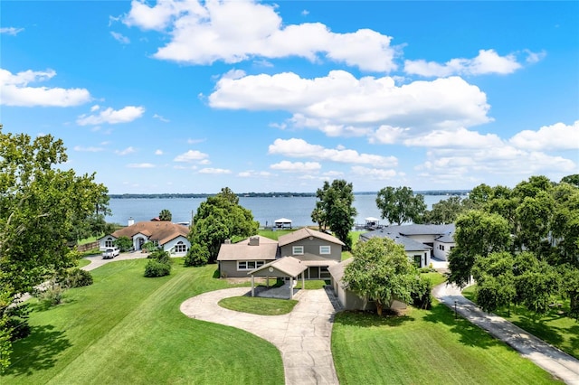 birds eye view of property with a water view